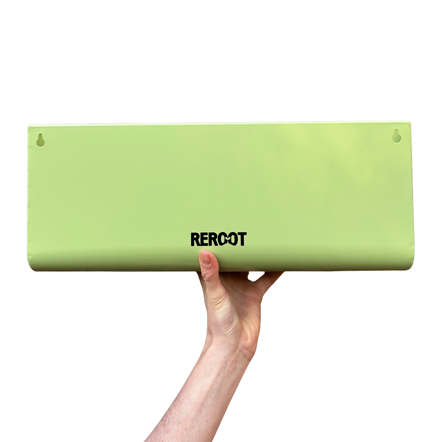 Empty stainless steel green planter held by a person's hand.