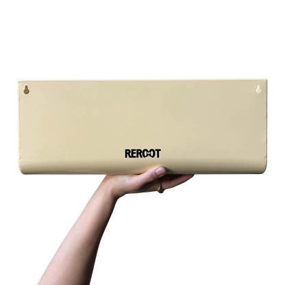 Cream stainless steel green planter held by a person's hand.