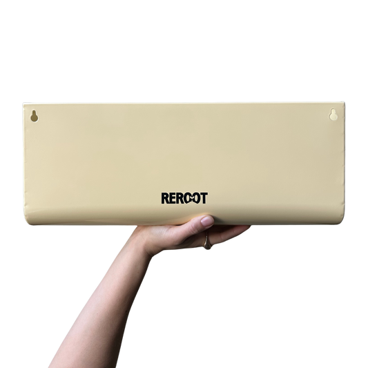 Cream stainless steel green planter held by a person's hand.